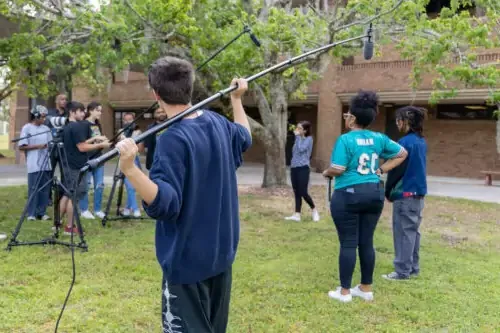 Students working a video production